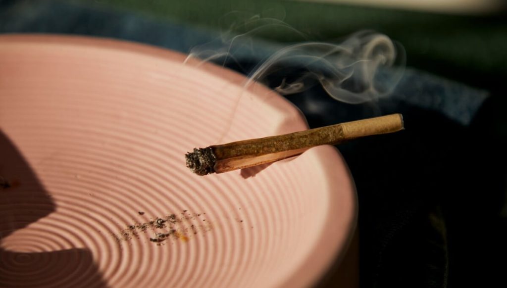 joint burning on an ashtray
