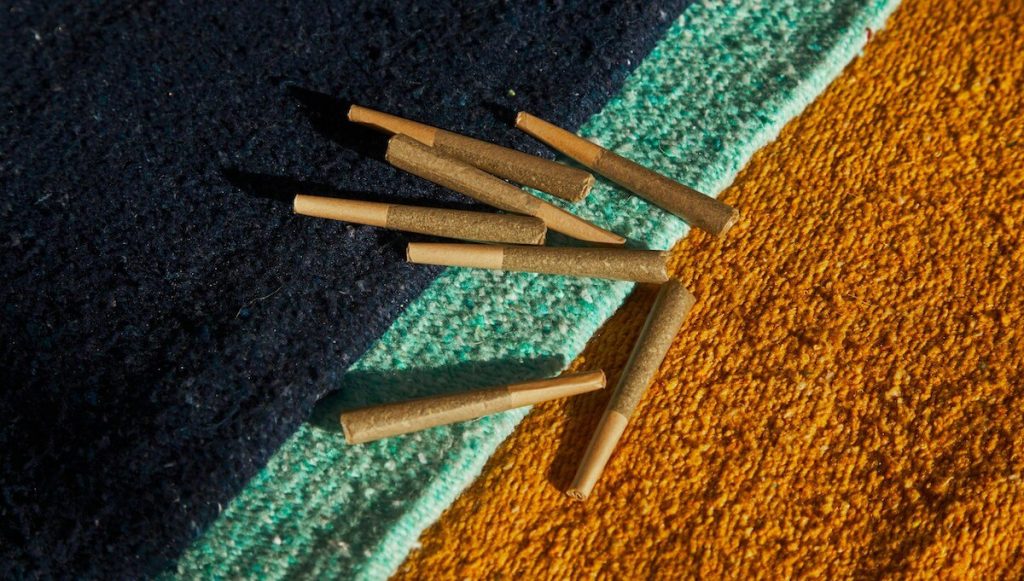 Half a dozen joints on a colorful background