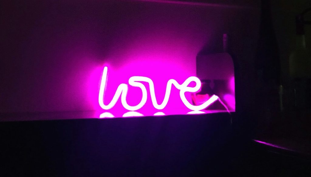 pink LED sign writing LOVE